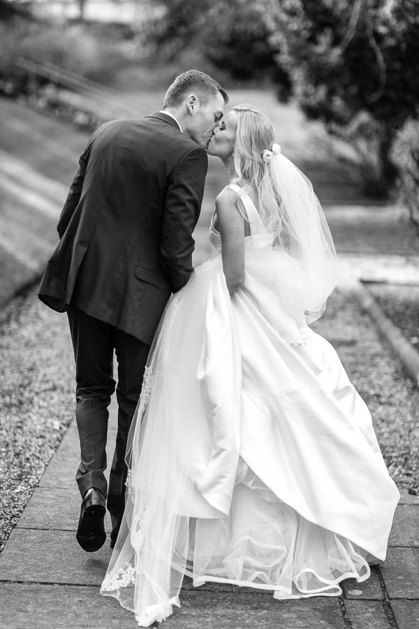 wedding couple kissing in the garden mar hall scotland 