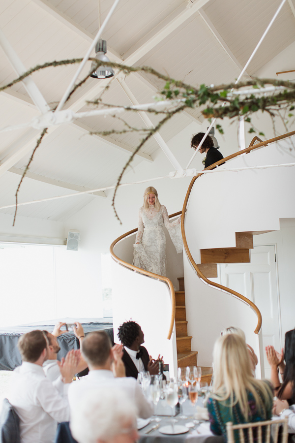 bride and groom walking down to reception