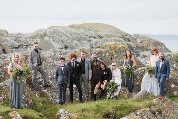 bridal party group shot with rocks wedding photos crear