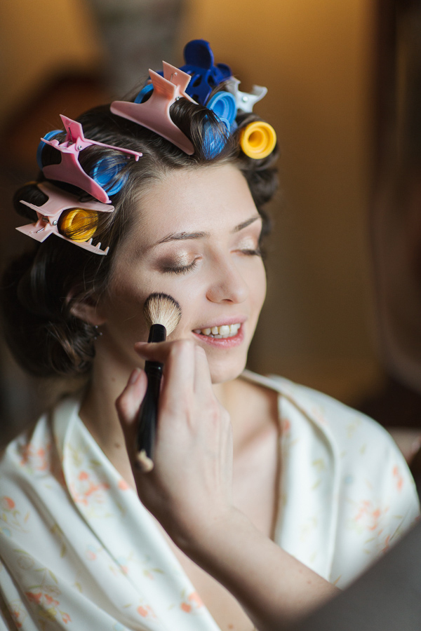 bride having her makeup done 