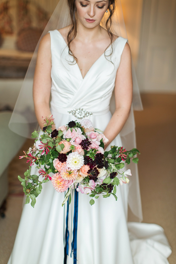 bride looking at her flowers just before ceremony