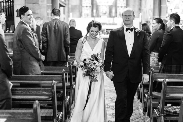 bride and groom walking the aisle together