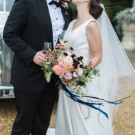 bride and groom kissing holding glasses dundas castle edinburgh