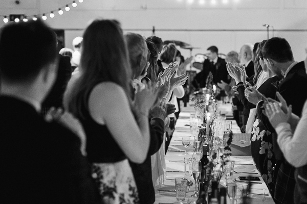 guests welcoming teh newlyweds at the reception