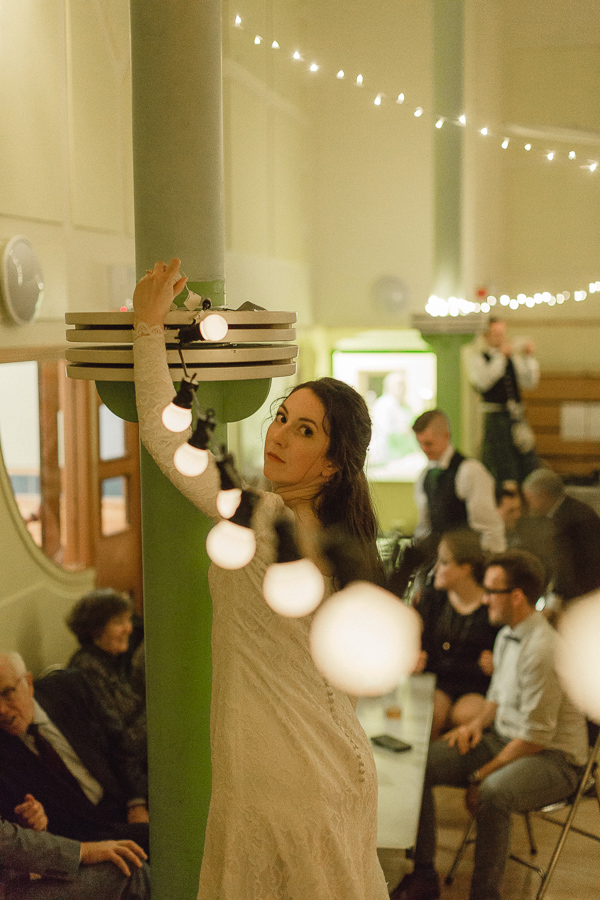 bride fixing lights at the venue