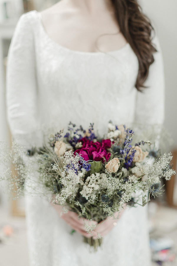 scottish bride holding dried flowers on isle of harris