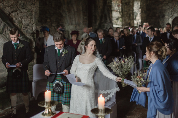 bride handing over the flowers to one of the bridesmates