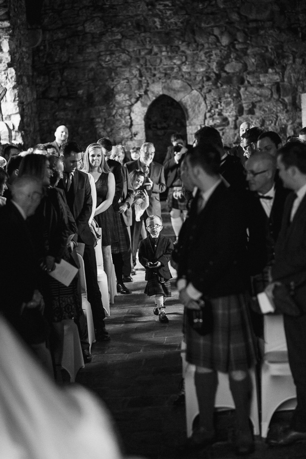 page boy walking down with wedding rings