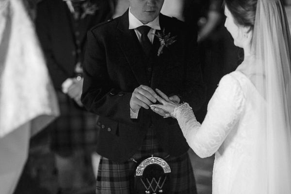 groom putting bride