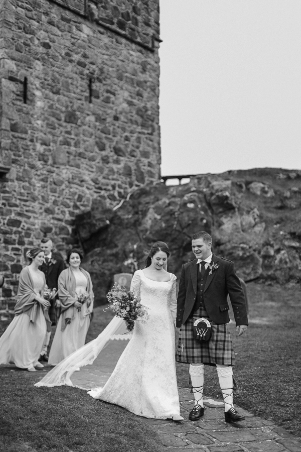 bridal party walking away after ceremony in scotland
