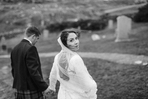 bride lookig back at the camera while walking