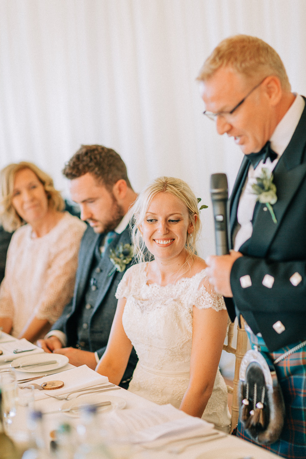 father talking at the wedding 