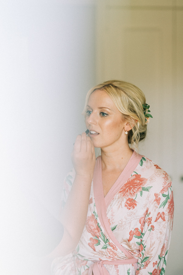 bride is getting her make up done