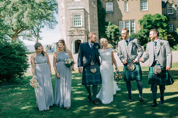 bridal party walking outside of boturich castle loch lomond