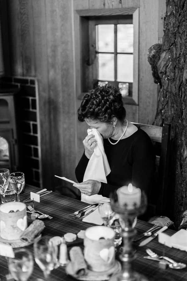 mother of the bride emotional reading her a note