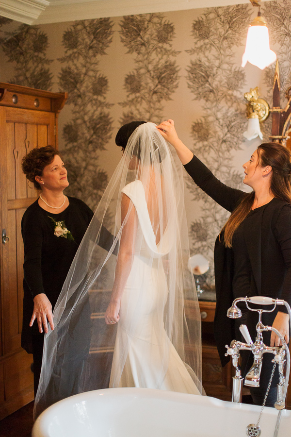 laura grey fixing brides veil at loch goil