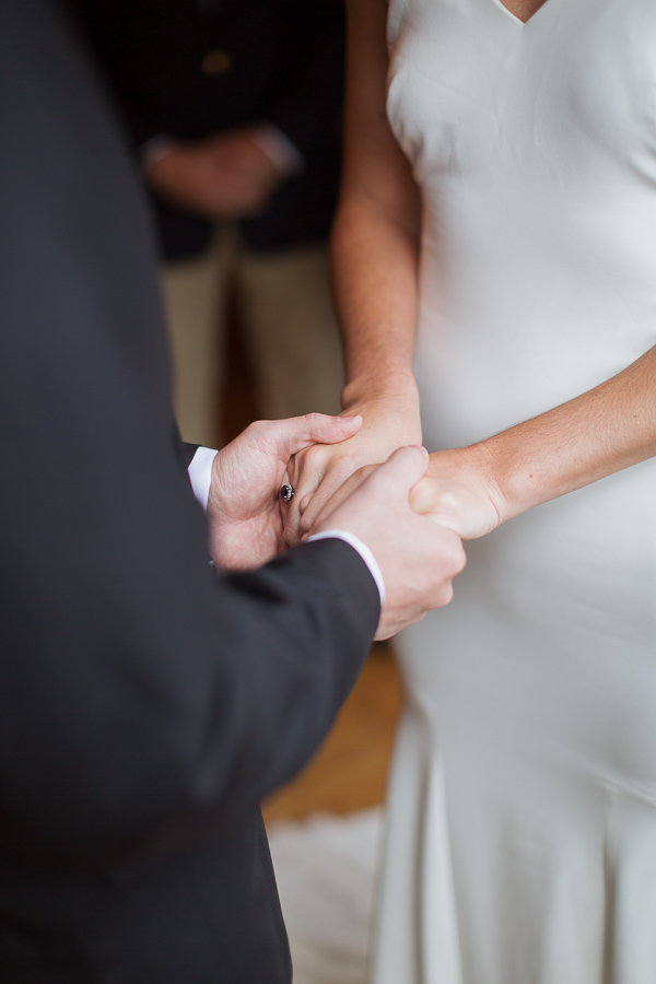 bride and groom holding hands