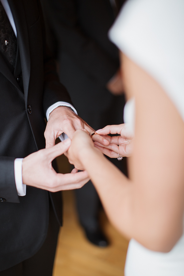 bride is putting groom