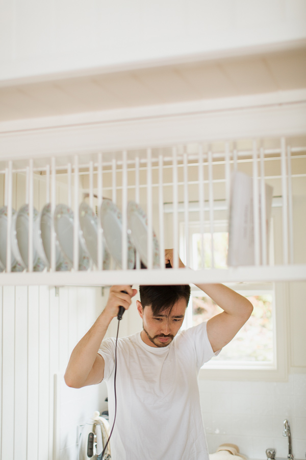 groom drying his hair during preparations