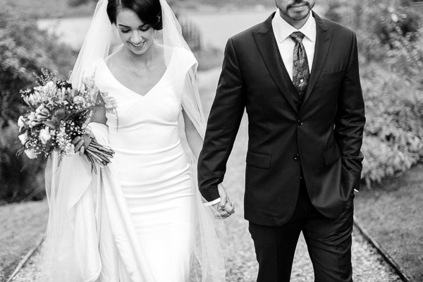 newlyweds walking at the lodeg gardens