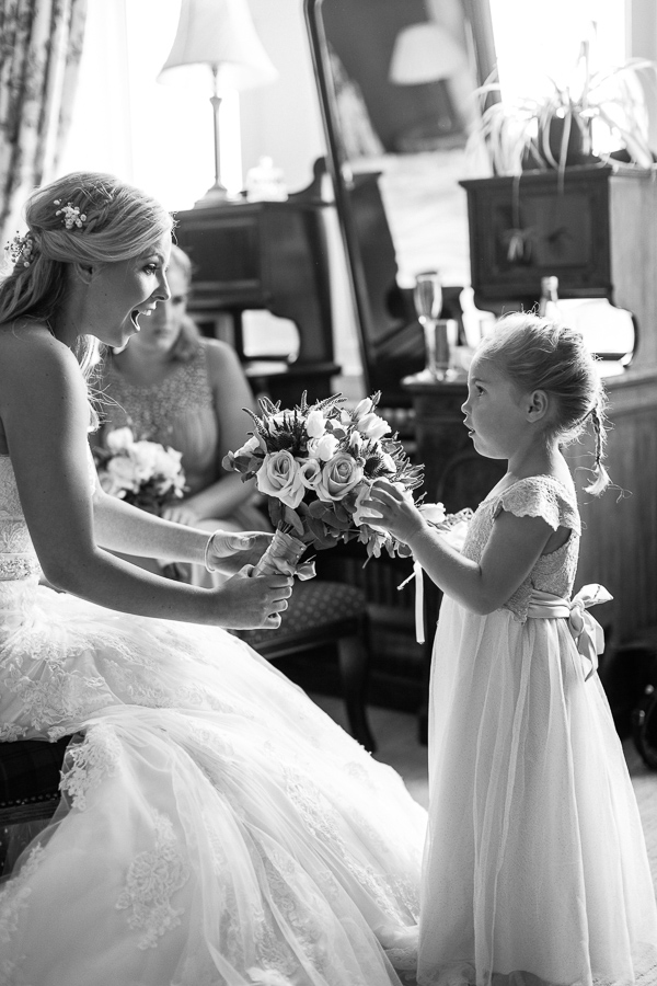 flower girl touching the bride