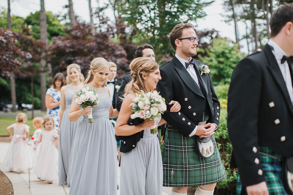 bridal party leaving teh ceremony