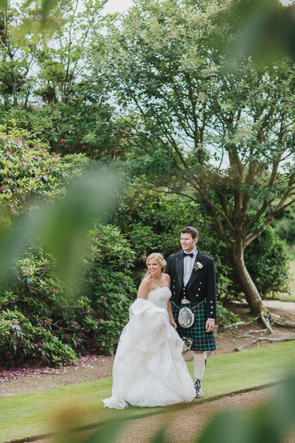 bride and groom together in the garden 