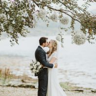 bride and groom kissing wedding at the lodge on loch goil by fotogenic of scotland