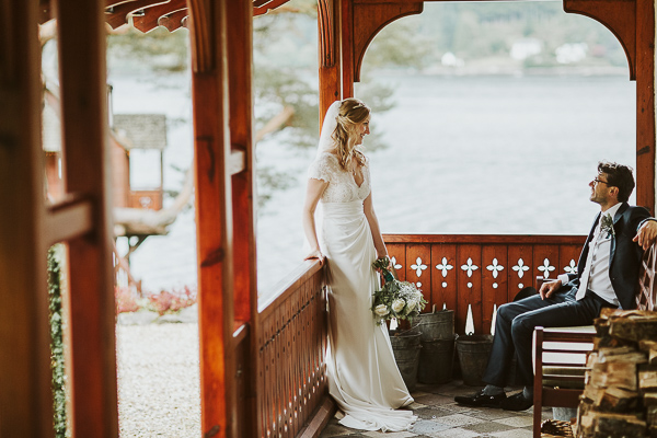 newlyweds looking at each other at the lodge on loch goil in scotland