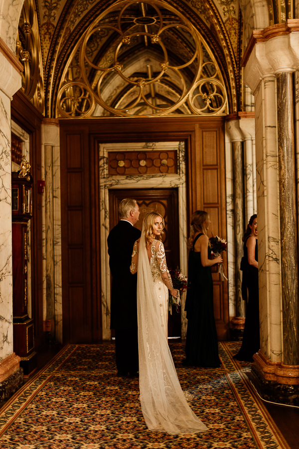 bride looking back just before going down teh aisle