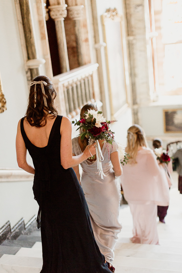 bridesmates walking down teh stairs