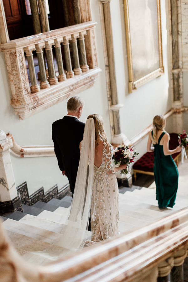 bride with father walking down teh stairs at mount stuart