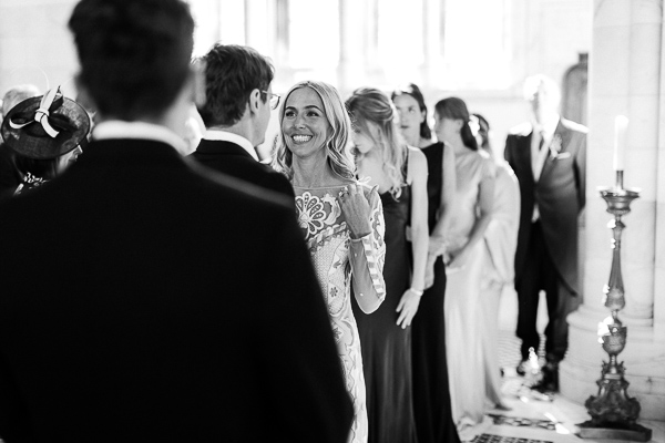 bride smiling at groom during scottish mass