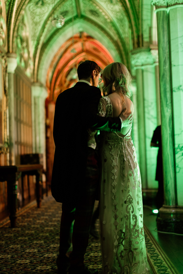 newlyweds embraced at wedding