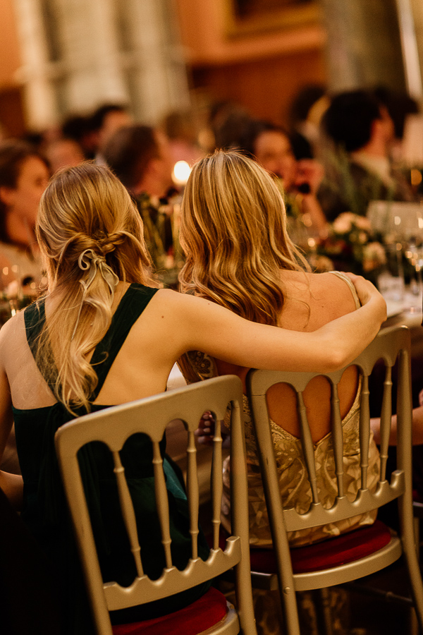 bride and bridemsate hugging at speeches
