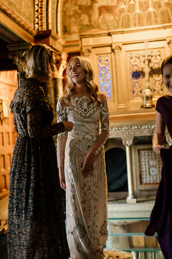 bride with friends in a golden chapel