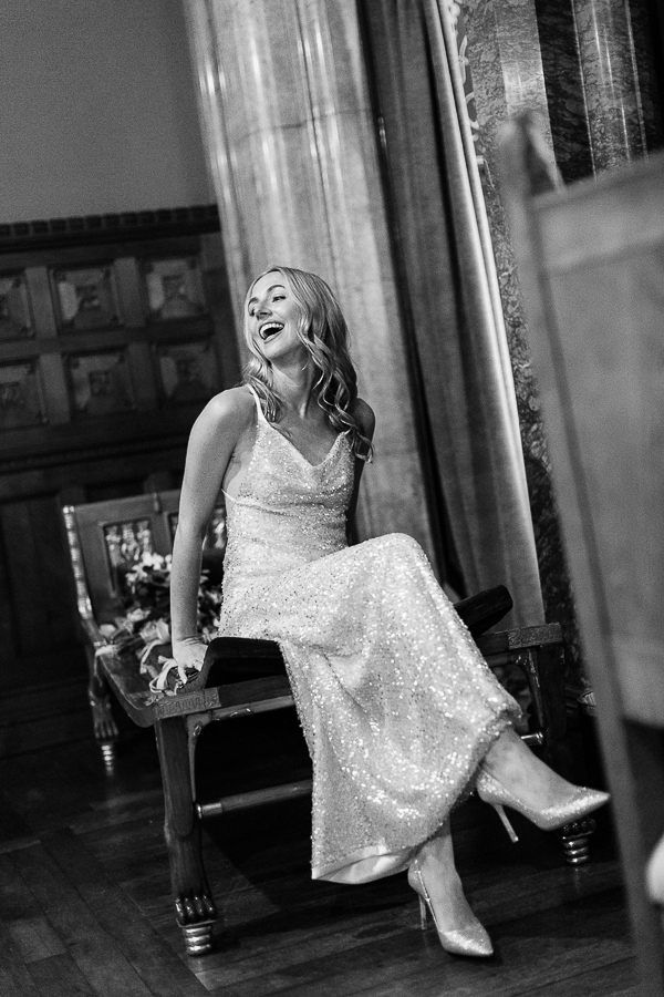 bride laughing sitting in a choroscope room