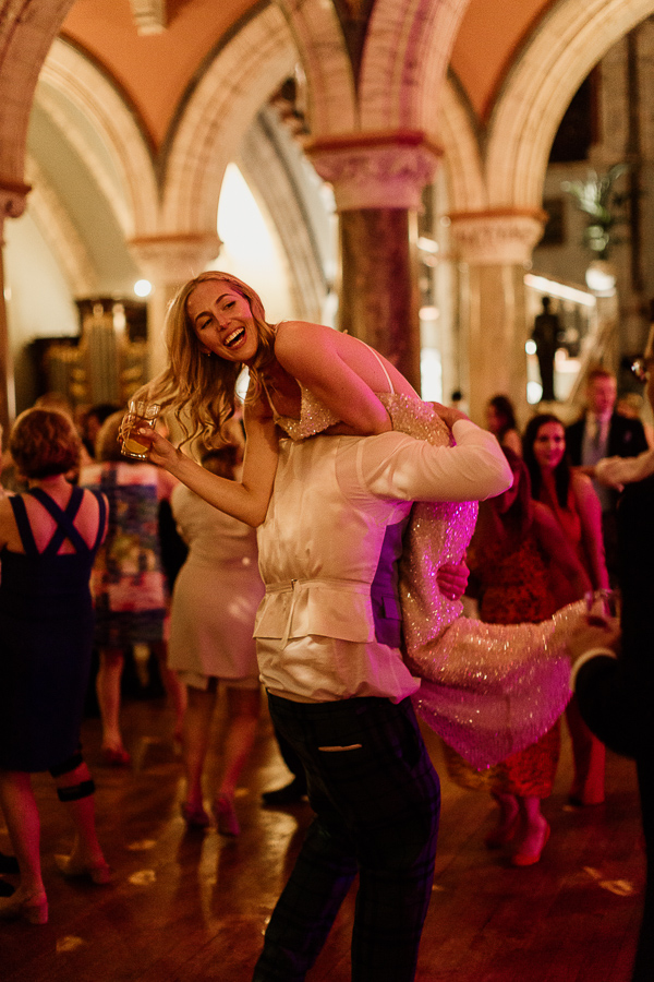 bride beeing picked up by grooman during dancing