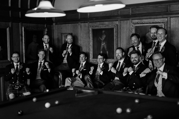 groom making boxing gestures posing for a photo scotland