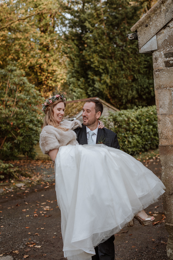 groom lifting up his bride at Glenapp Castle Scottish 5 star venue 