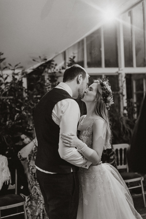 evenin kiss of the couple at their wedding in glenapp estate ayrshire