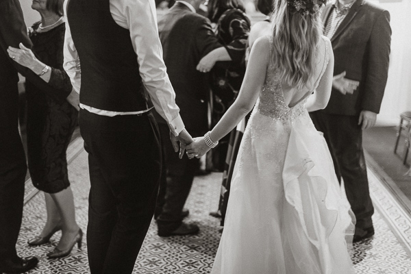 holding hands at the evenig reception in Glenapp Castle Estate 