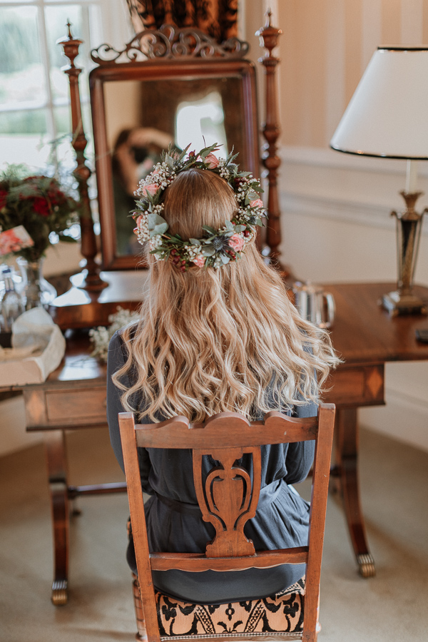 Bride in her silk robe  at Glenapp Castle Suite getting ready 