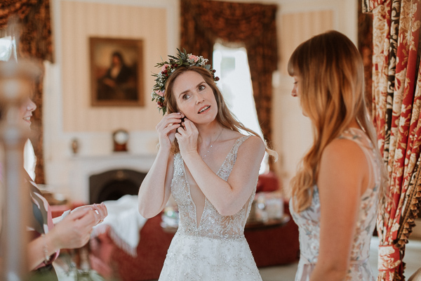 bride trying her earings at Glenapp Castle Ayrshire 