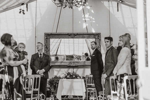 groom awaits the bride to arrive at green house Glenapp Castle 