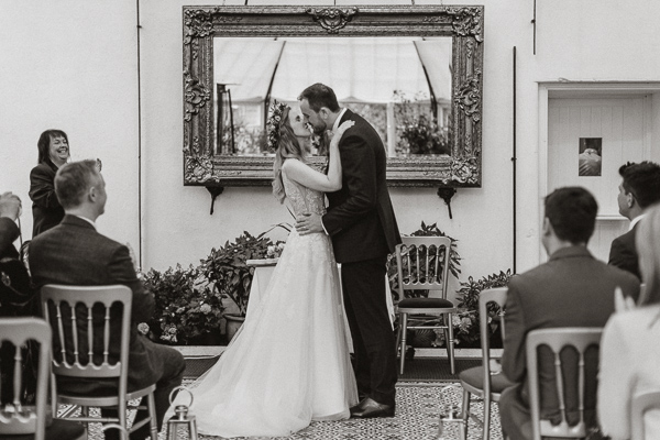 first kiss during a wedding at Glenapp Greenhouse