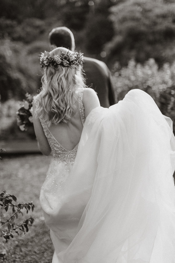 newlyweds walking in the Glenapp gardens