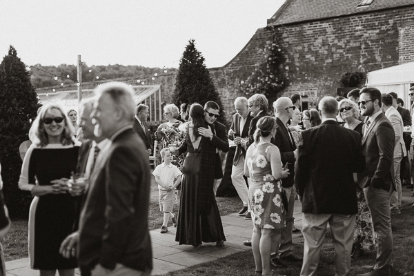 guests greeting bride to be at pre wedding party
