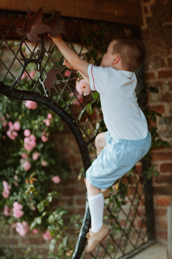 page boy climbing before wedding 