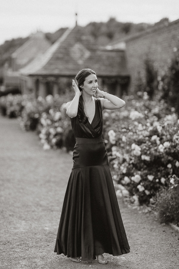bride fixing her hair in the gardens of dumfries house